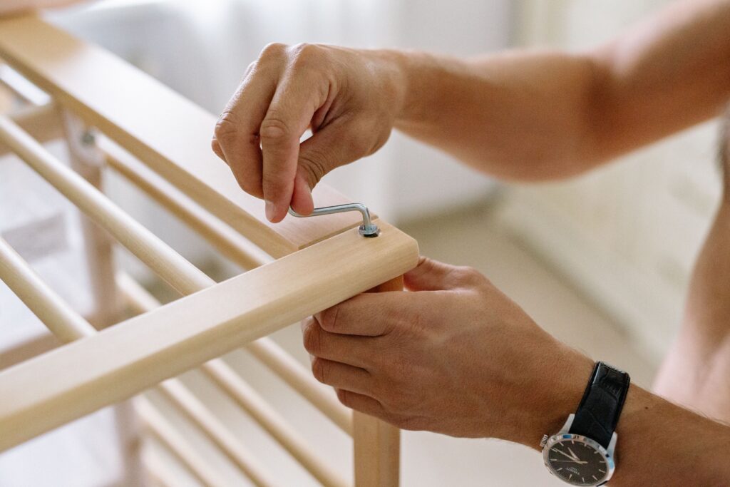 hands of someone assembling furniture
